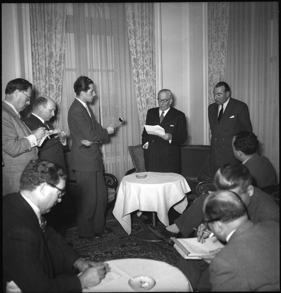 Professor Pirenne (l) reads statetment from Leopold of Belgium, Geneva 1950