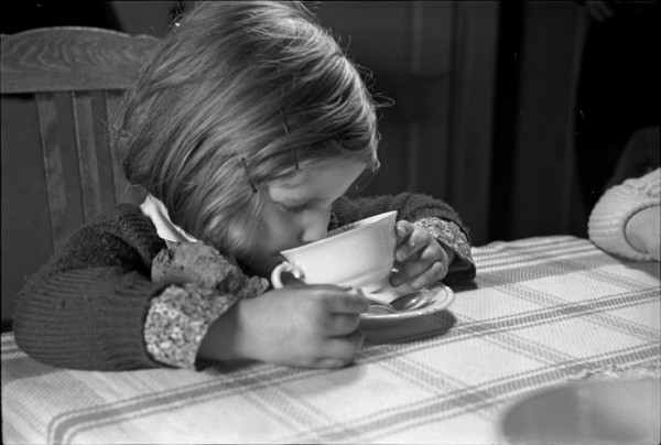 Girl drinking milk, around 1960