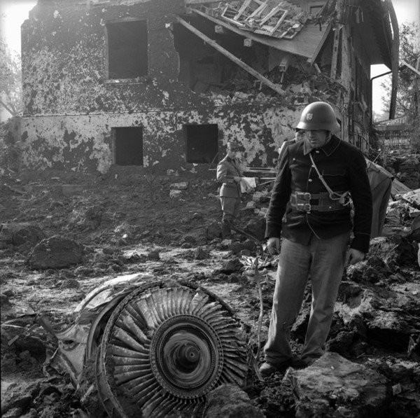Caravelle crash Durrenasch 1963: fireman looking at remains at the scene of the accident.