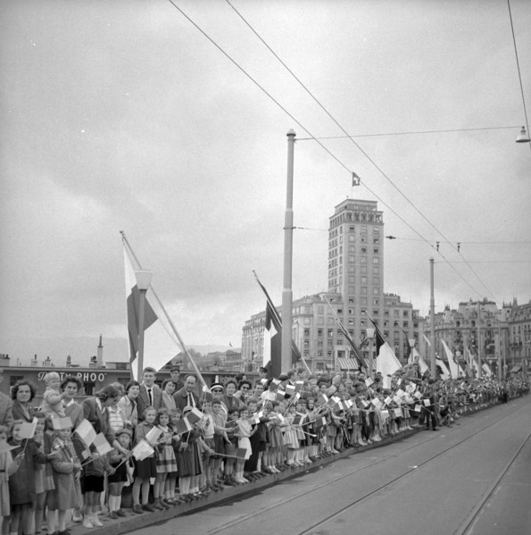 50th anniversary of the Simplon railway tunnel, onlookers waiting roadside in Lausanne 1956.