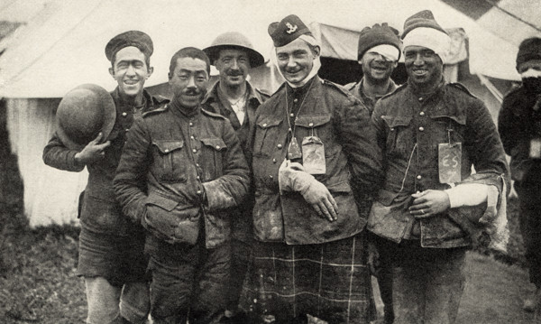This photo shows Canadian troops who fought in World War I. The caption reads: Cheerful Beggars.