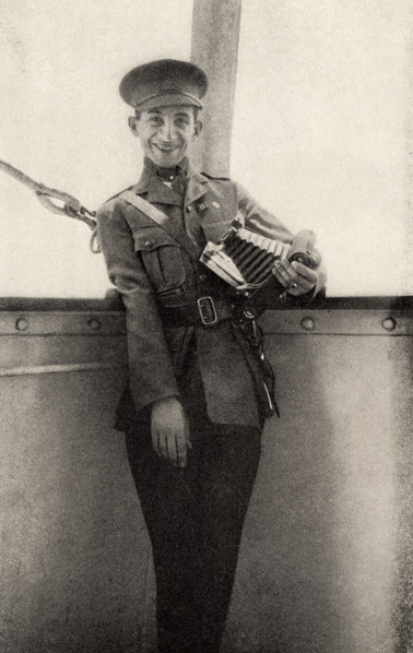 This photo shows Private Peat who fought in World War I. The caption reads: Still smiling though