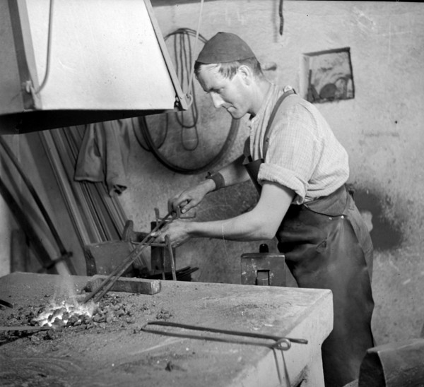 Forge, nailer making nails; 1940.
