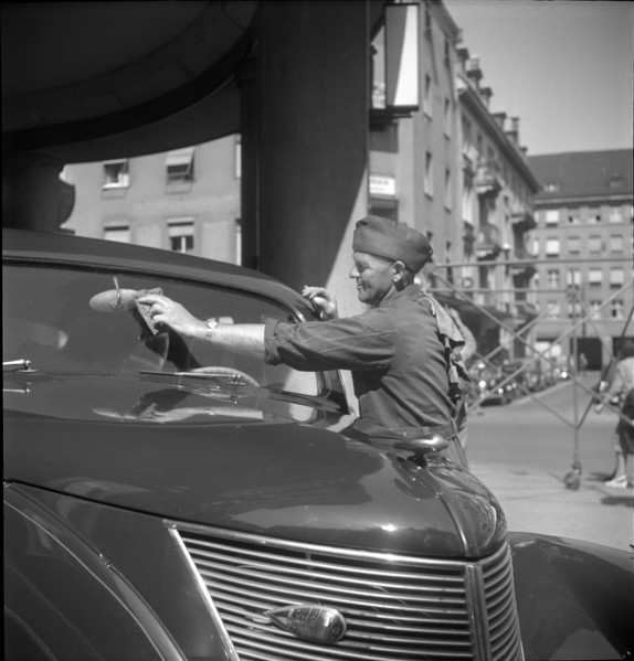 Filling Station Attendant Cleans Window, 1950.