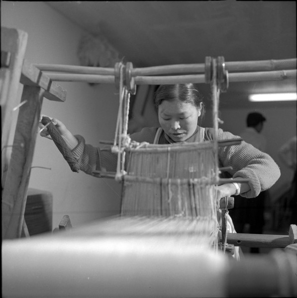 Tbetan woman at manual loom, Waldstatt 1963.