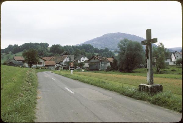 Cross on the roadside in Vellerat, 1980.