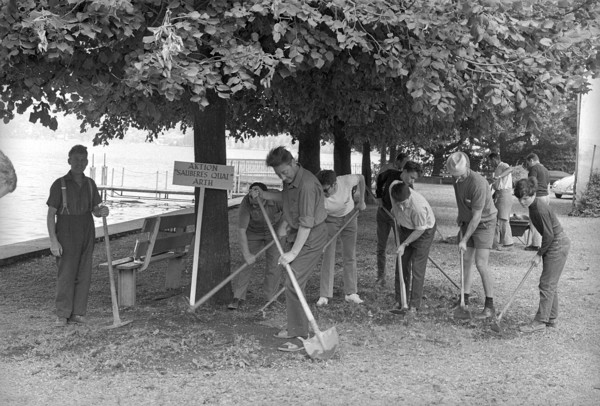 Inhabitants of Arth cleaning lakeside walk near Lake Zug 1970.