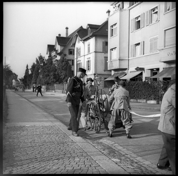 War fire brigade: men with hose cart, 1939.