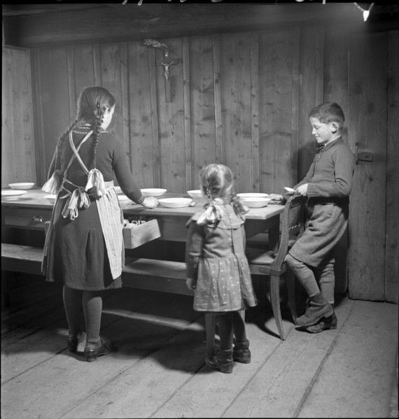 Farmer's children setting the table in 1941