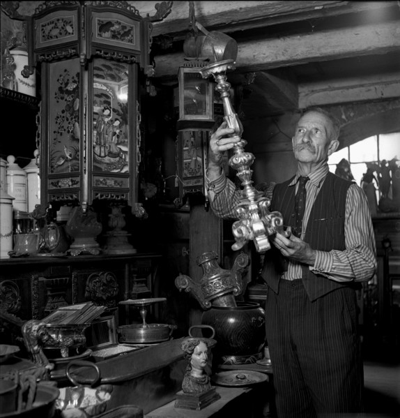 Geneva: antique dealer in his shop; 1943