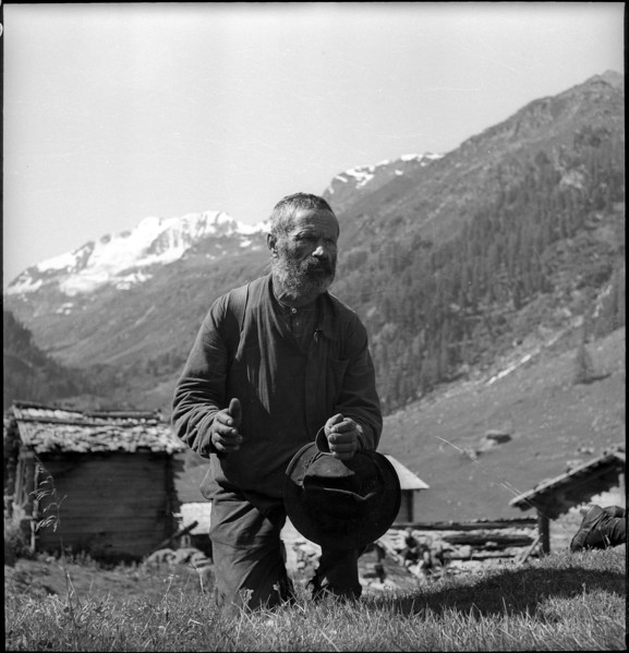 Farmer praying in the Turtmanntal valley, Switzerland, 1940
