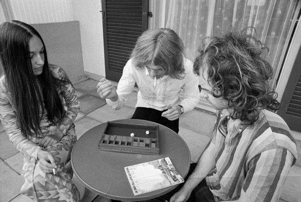 Young adults playing a board game, 1972