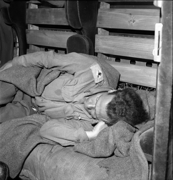 Sleeping soldier of British Army on train back home 1945