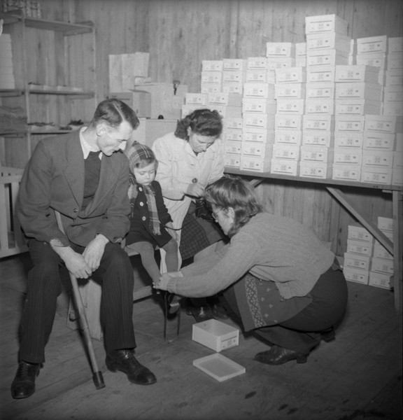 Disabled child getting new shoes, 1945