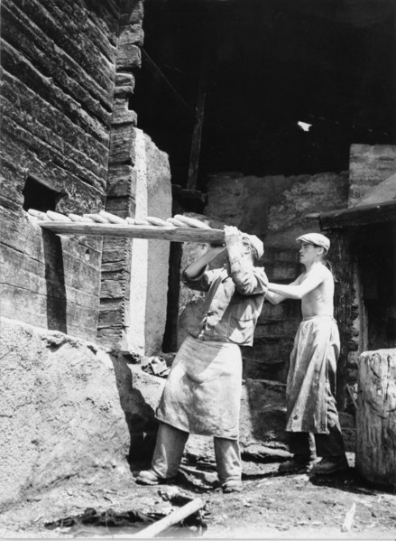 Baking bread in mountain village in Valais, historical