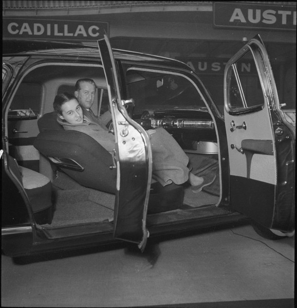 Visitors test the comfort of the interior trim