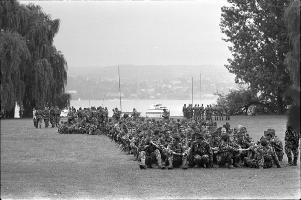 Military Parade 1969 in Switzerland: Soldiers having a rest in a park