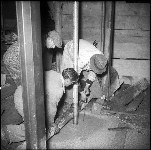 Movie theater owner searching drilling for oil; 1955