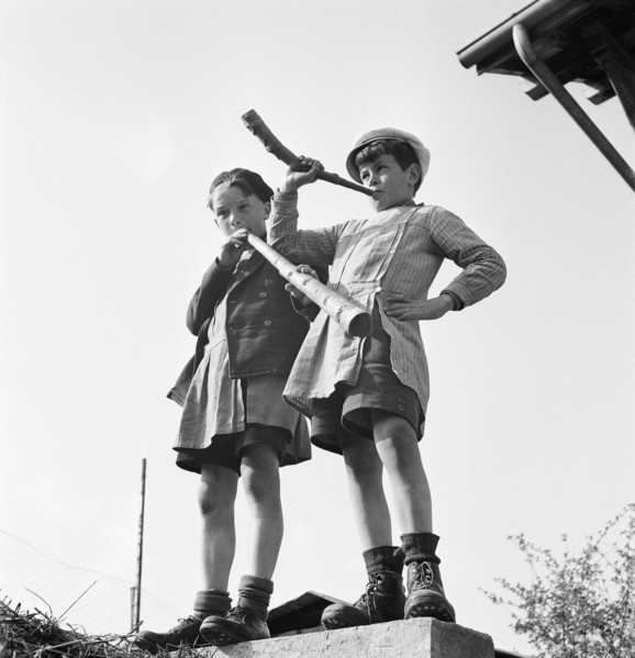 Boy playing the horn on the day of Feuillu, 1944