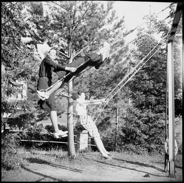 Young nurses swinging in the garden