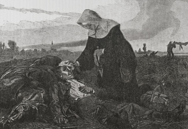 Franco-Prussian War (1870-1871). Sisters of Charity on the battlefield, tending to the wounded.