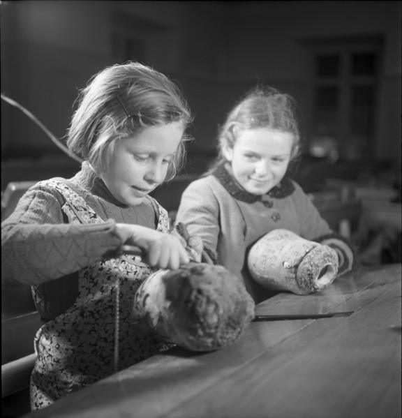 Children make pumpkin lanterns for school New Year's Eve 1945