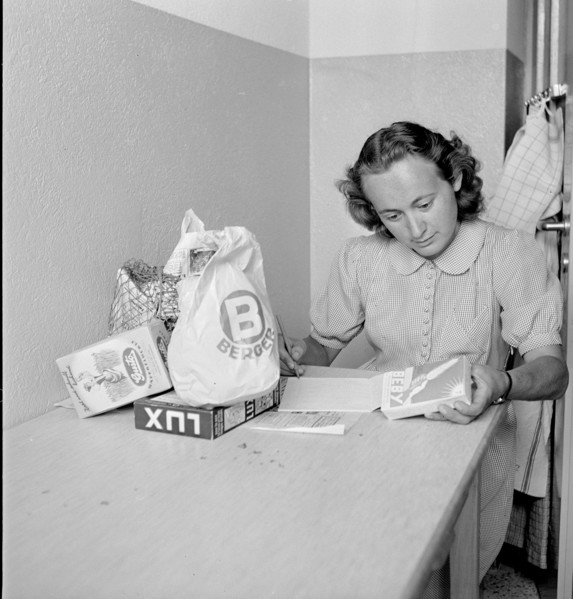 Young woman with her shopping; 1945