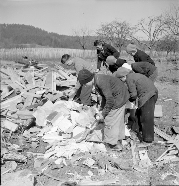 WW 2: bombing Rafz 1945. children, debris