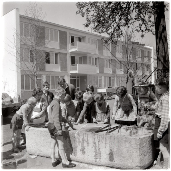 Children playing at trough