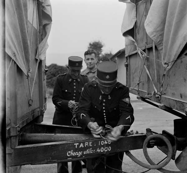 French customs officers seal Swiss trucks; 1944