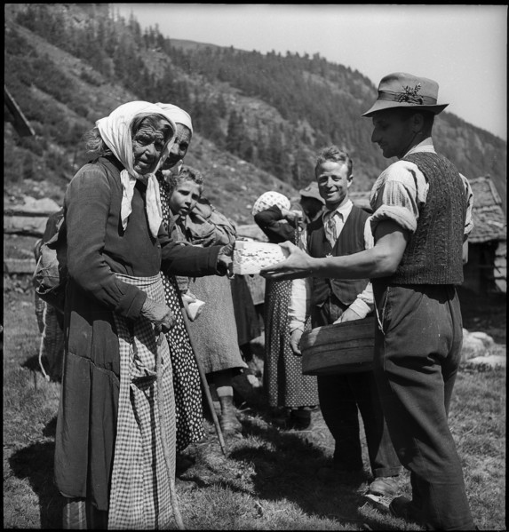 Cheese donation in the Turtmanntal valley, Switzerland, 1940.