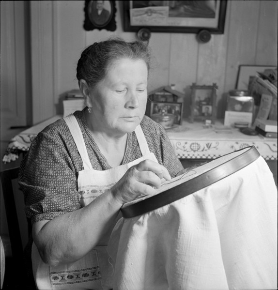 Woman embroidering, 1941.
