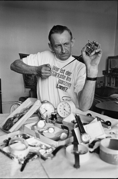 Chrampf-Olympiade; Man reparing alarm clock 1969.