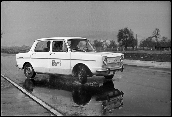 Anti skidding school; car on wet street 1971.