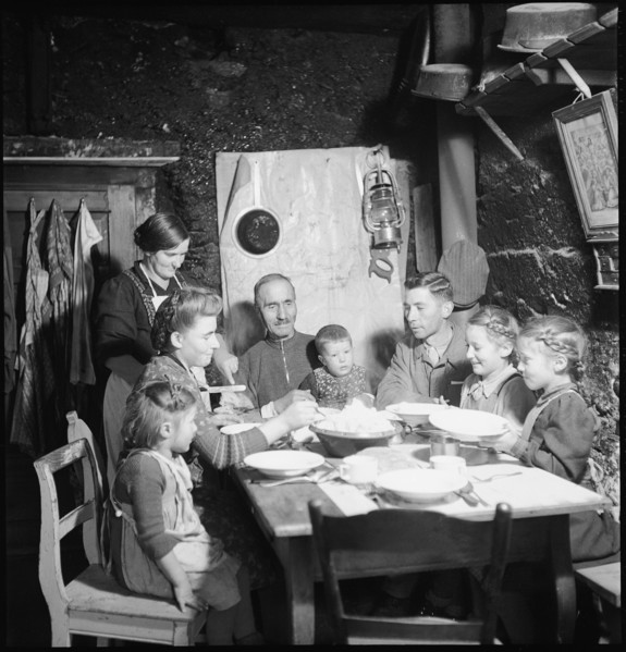 Family eating together, 1946.