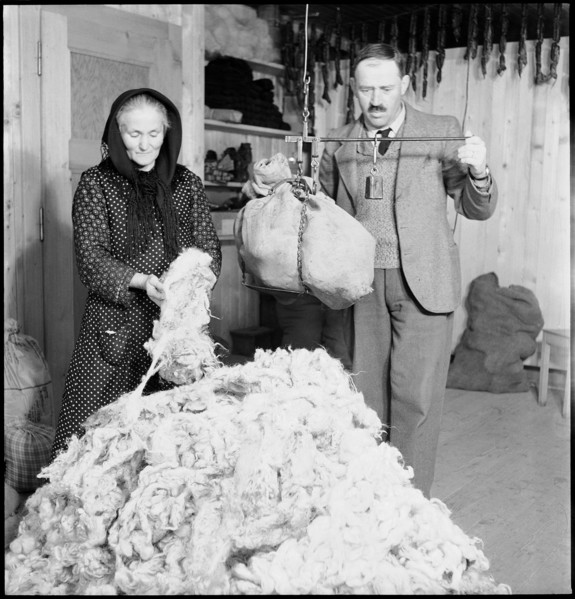Man and woman weighing wool, 1945.