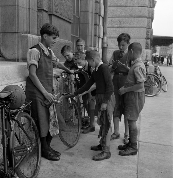 Basle, boys cleaning bicycles; 1941.