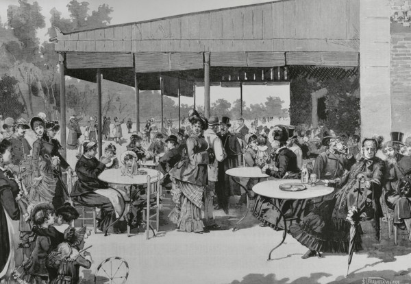 Madrid, Spain. Scene at Retiro Park, featuring elegantly dressed people enjoying the afternoon.