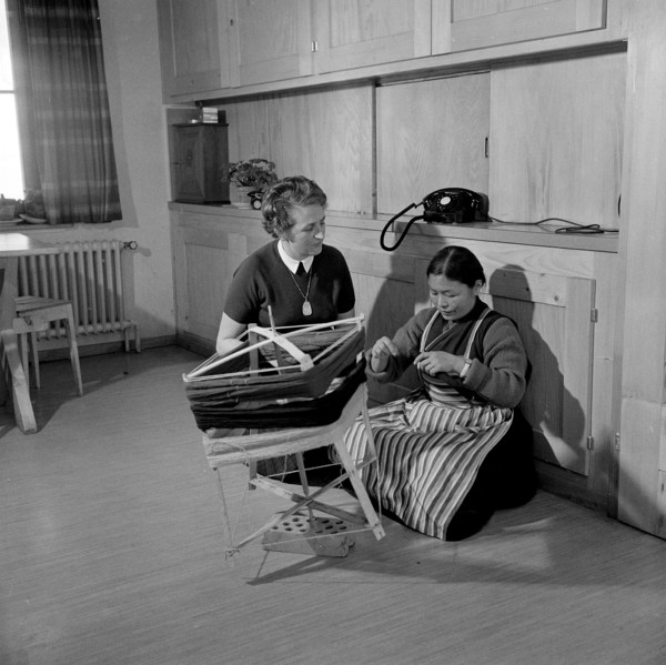 Tibetan woman with traditional textile work, Waldstatt 1963.