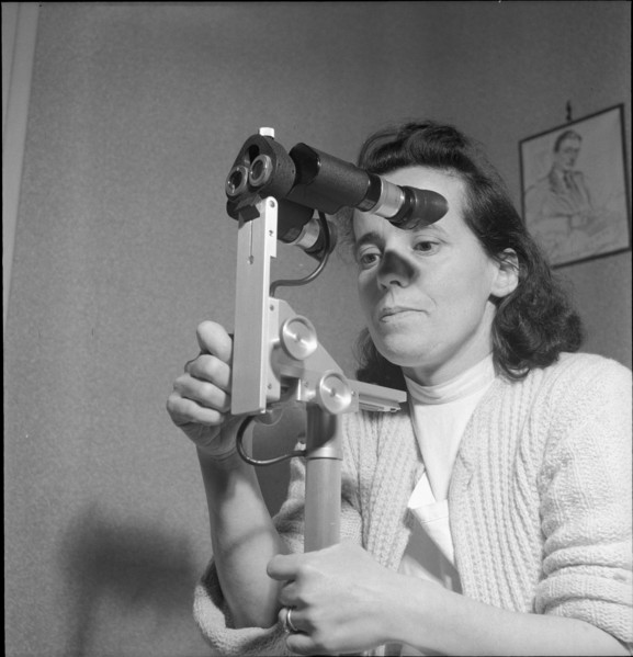 Woman with colposcope for the gynaecological check-up, Geneva 1951.
