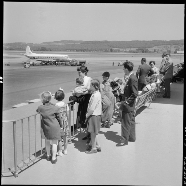 Gerold Zust with Hungarian children at airport Kloten 1957.