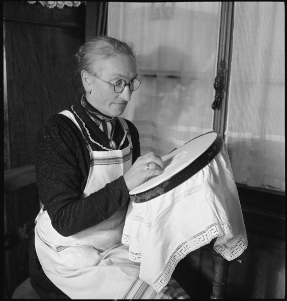 Home embroideress at work, 1942.