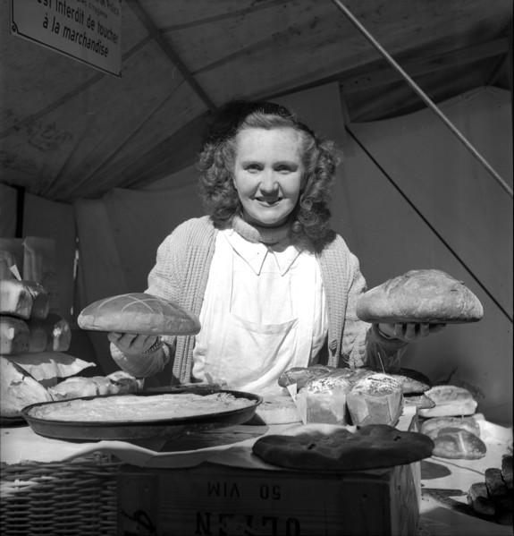 Baker with bread, 1949.