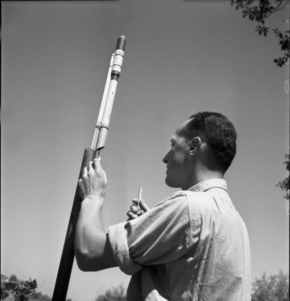 Man with hail defense rockets, 1951.