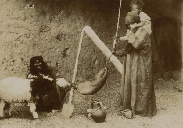 Arabs making butter. 
	
		1920-1940