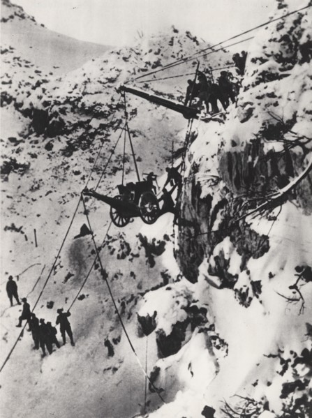 Carrying a cannon to a summit.