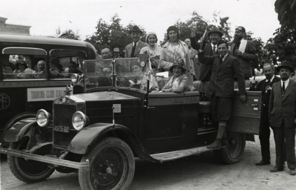 Members of the Touring Club Italiano  on board a car. 
	
		1931