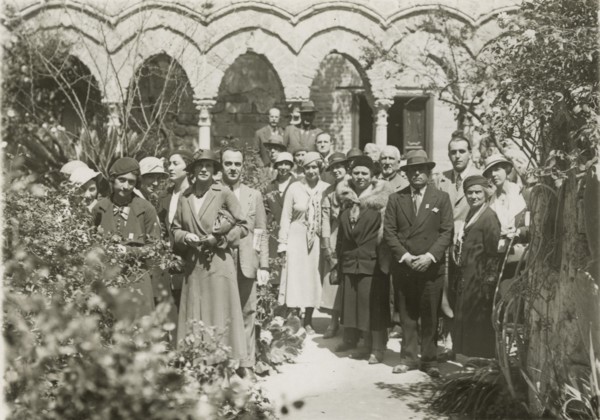 Members of the Touring Club Italiano visiting the cloister of Monreale Cathedral. 
	
		1924