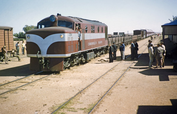 Commonwealth Railways diesel engine train with freight wagons and passenger carriages, Alice