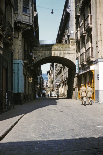 Soldiers walking along historic cobbled street in Old Town, Parte Vieja, San Sebastian, Donostia‚
